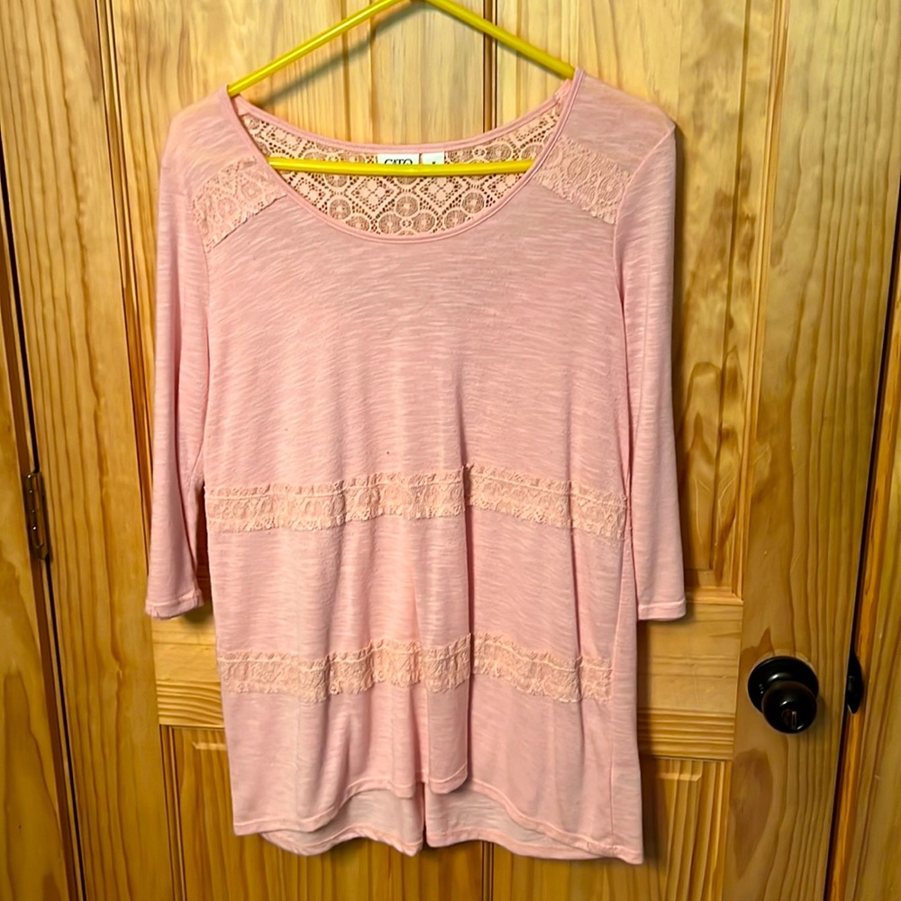 Light pink 3 quarter sleeve blouse with detail.